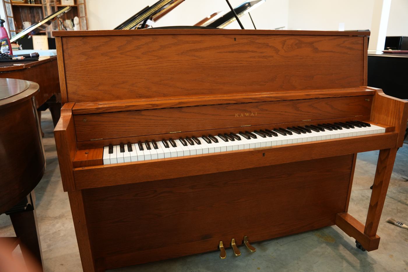Kawai UST-8A Upright Piano in Light wood / teak-look – Featured image – Roberts Pianos Houston
